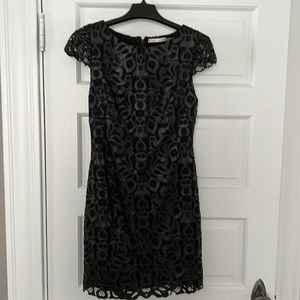 Alice & Olivia black cut-out “leather look” lined sheath dress.